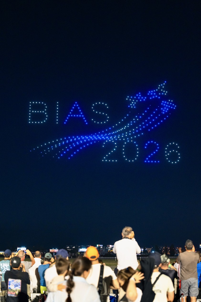 The words BIAS 2026 and an aircraft silhouette drawn with drones against the night sky over Baneasa Airport